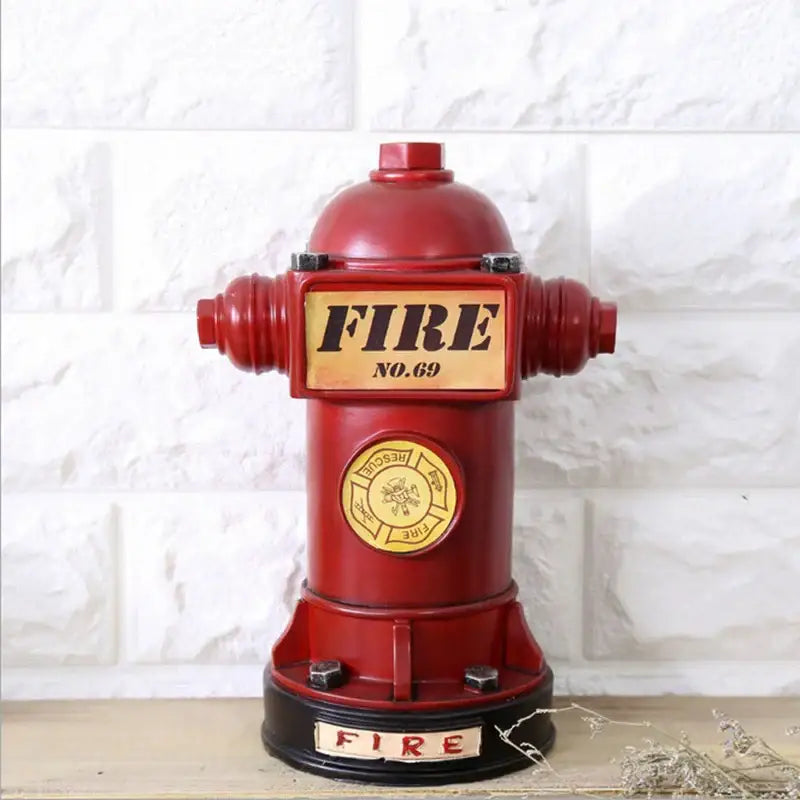 Vintage red and yellow hydrant piggy bank with black base and gold accents for living room decor