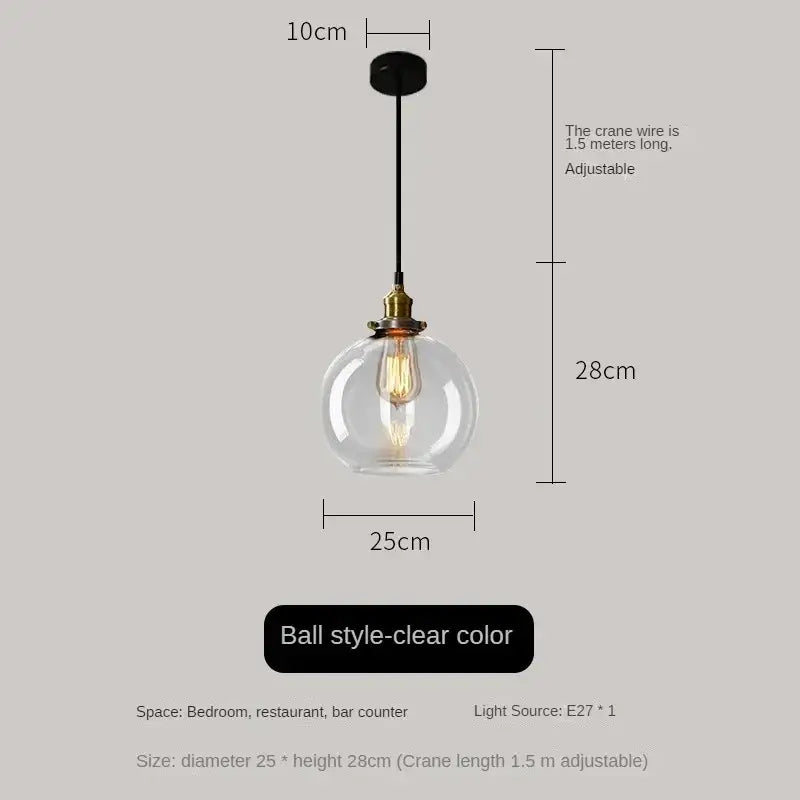 Clear glass ball pendant light with brass fixture and exposed filament bulb in vintage smoked amber glass pendant light set of 4