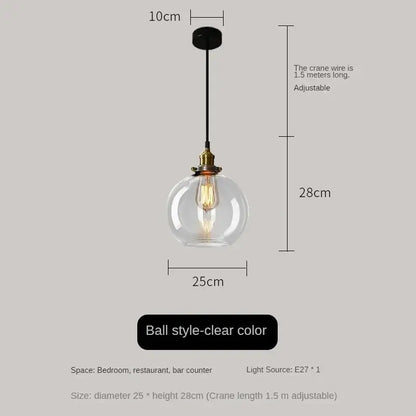 Clear glass ball pendant light with brass fixture and exposed filament bulb in vintage smoked amber glass pendant light set of 4