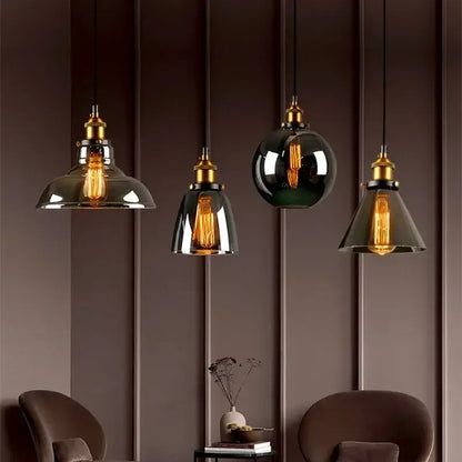 Set of four vintage pendant lights with brass fixtures and decorbites amber glass vintage smoked shades for dining room