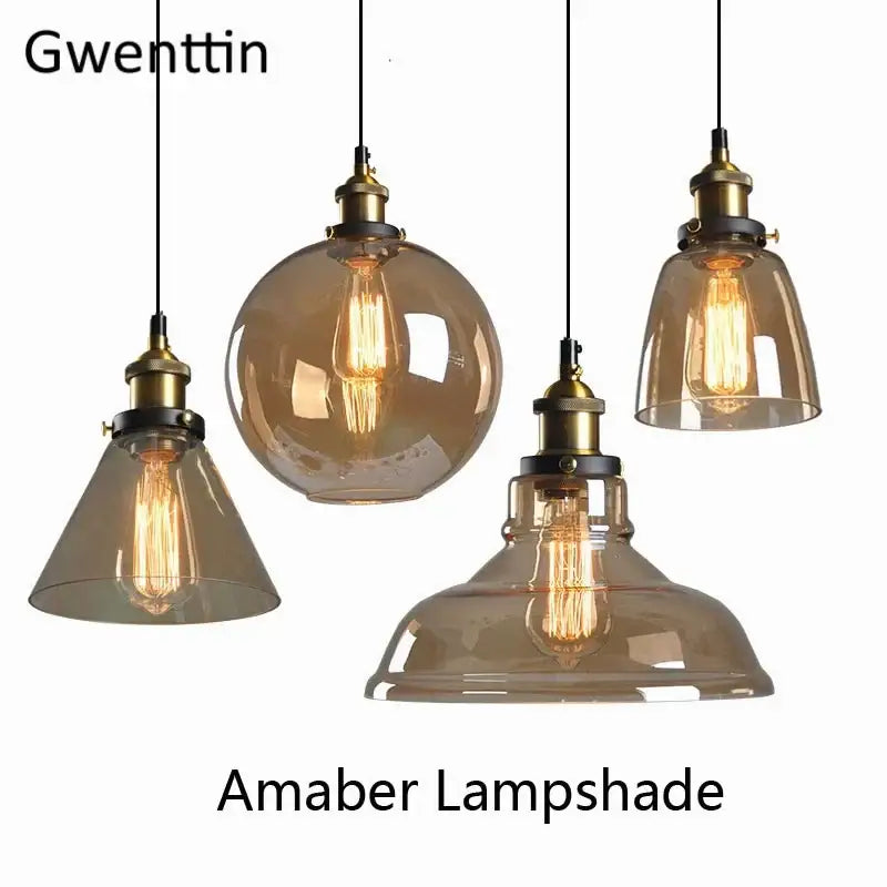 Set of four amber glass pendant lights with brass fixtures and vintage filament bulbs decorbites industrial glass design