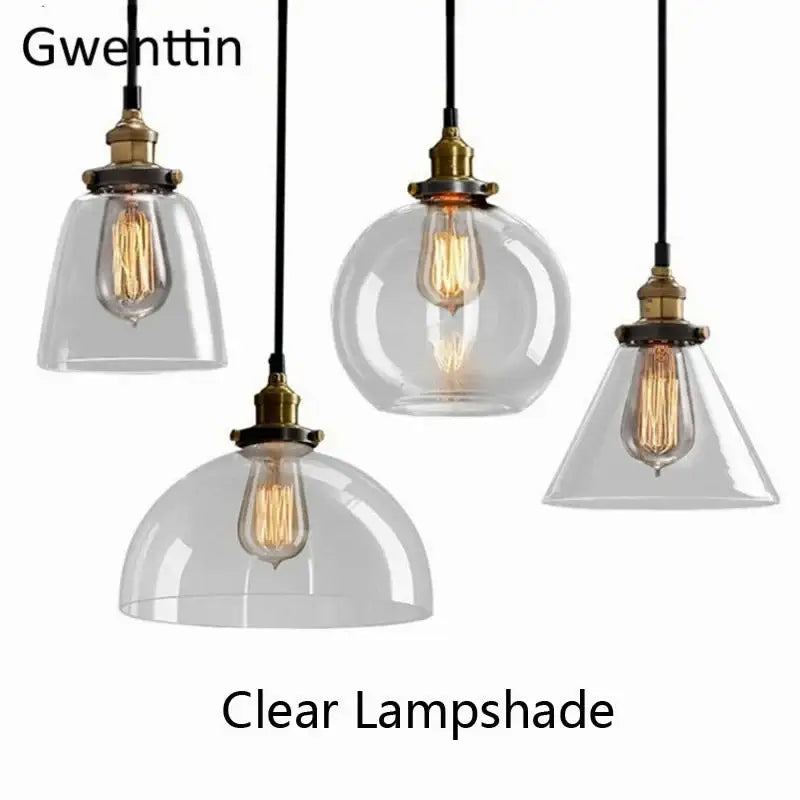 Clear glass pendant light with brass-finished fixtures and exposed filament bulbs decorbites industrial glass design