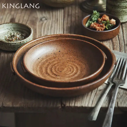Earthy brown decorbites ceramic round swallow plate with speckled glaze and concentric ridges for dining room use