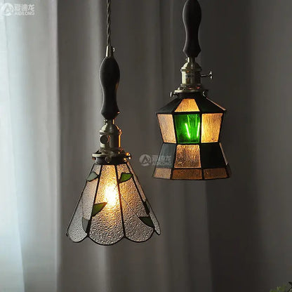Vintage stained glass copper pendant lights with wood knob switch featuring green leaf and amber geometric shades