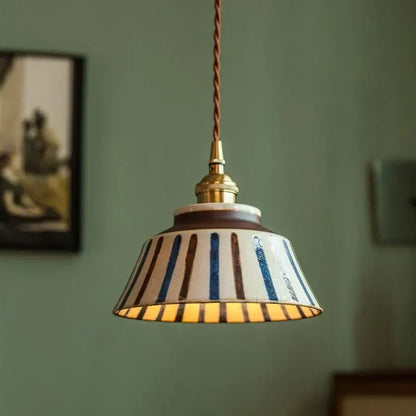 Ceramic pendant light with vintage blue and brown striped coloured glaze shade on twisted copper cord for dining room decorbites