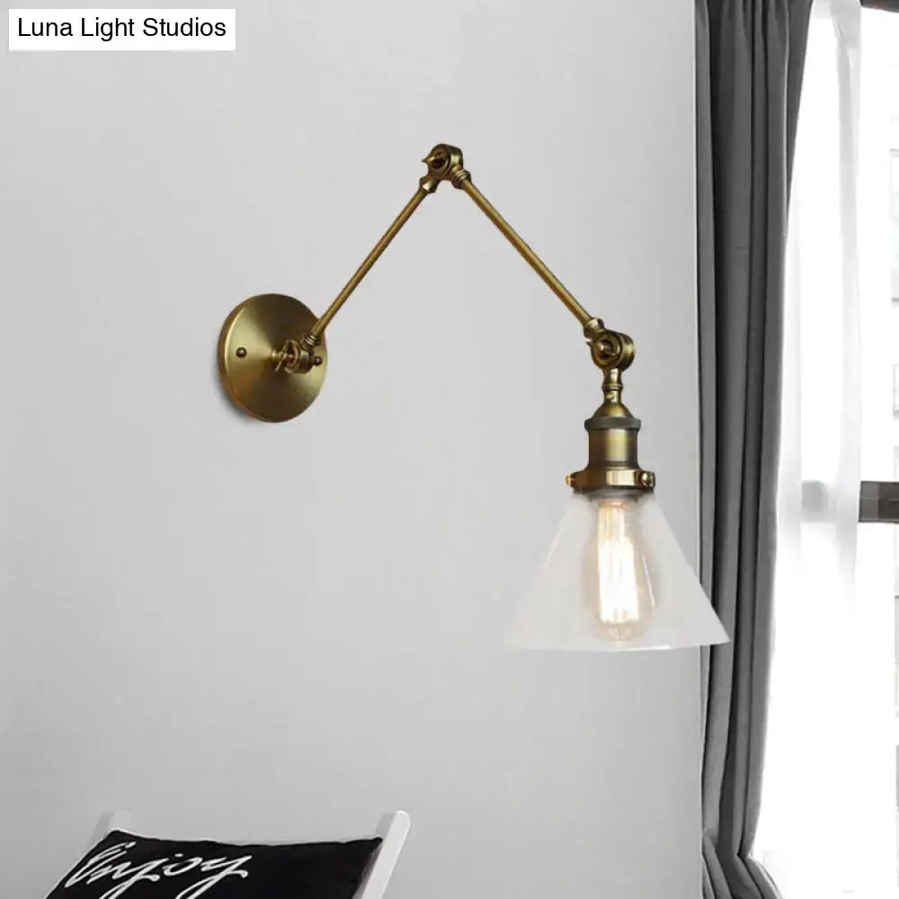 Brass-finished vintage style adjustable wall sconce with frosted glass shade and exposed edison bulb in satin brass