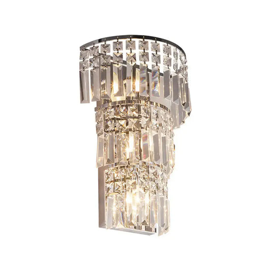 Vintage style clear crystal tiered chrome wall sconce with cascading faceted prisms for hallway lighting