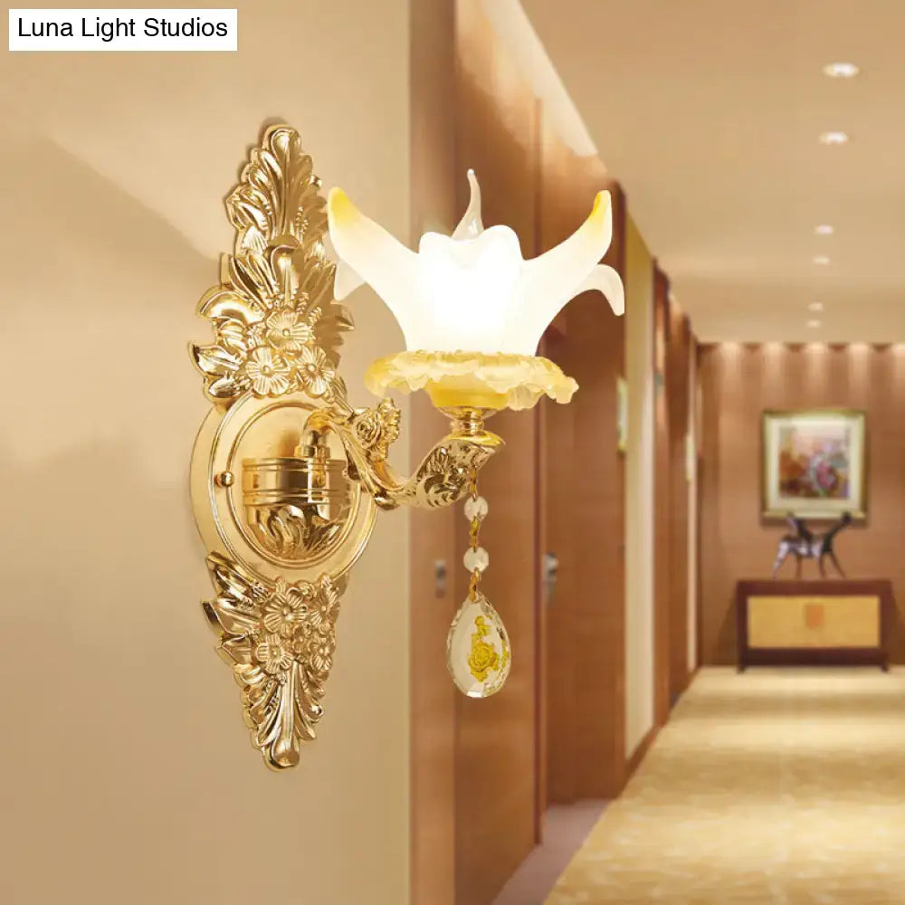 Vintage style gold wall light with opal glass flower shade and crystal teardrop pendant for bedroom decor