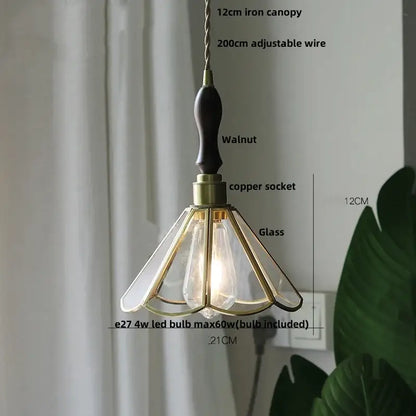 Vintage teal blue glass led pendant light with dark walnut handle brass accents and gold-toned metal framing decorbites blue glass