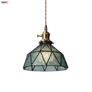 Vintage teal blue glass led pendant light with textured shade, black geometric lines, and brass-finished hardware for kitchen decorbites blue glass lighting