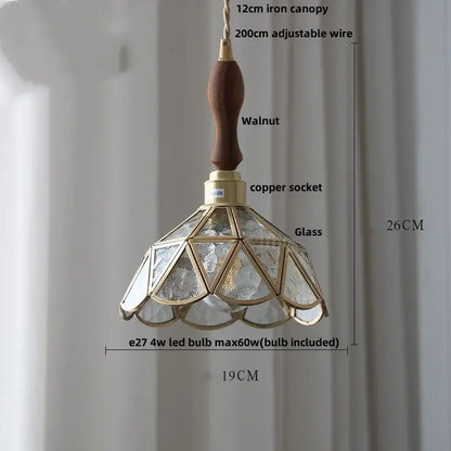 Vintage teal blue glass LED pendant light with walnut handle brass accents and geometric textured glass panels decorbites blue glass