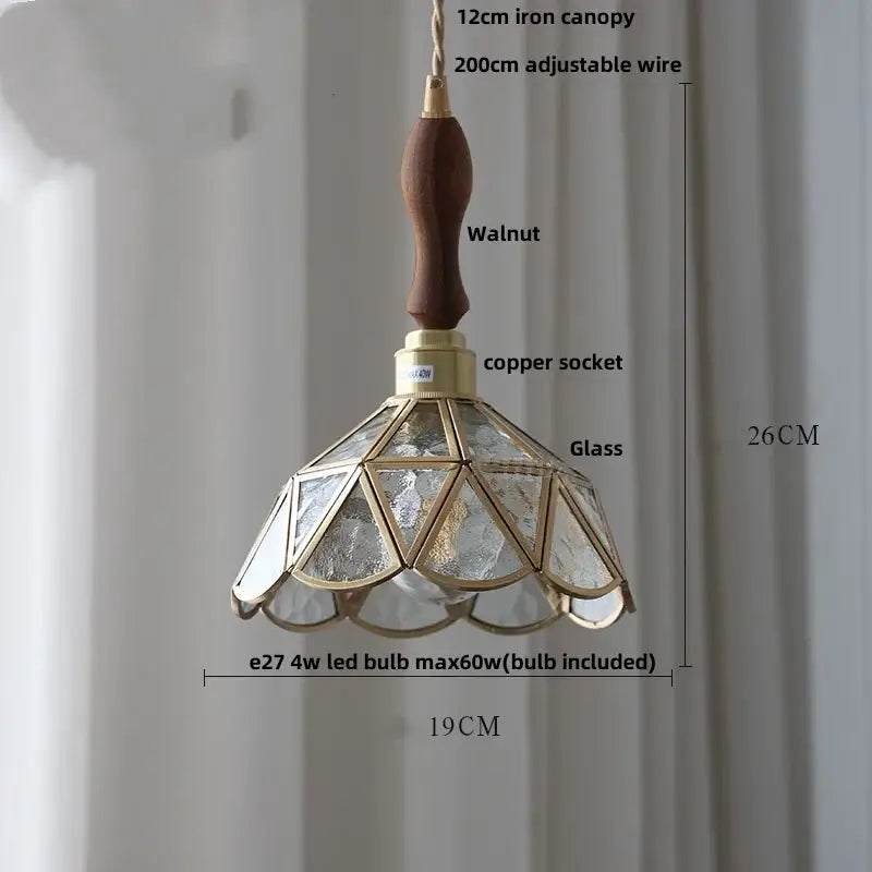 Vintage teal blue glass LED pendant light with walnut handle brass accents and geometric textured glass panels decorbites blue glass
