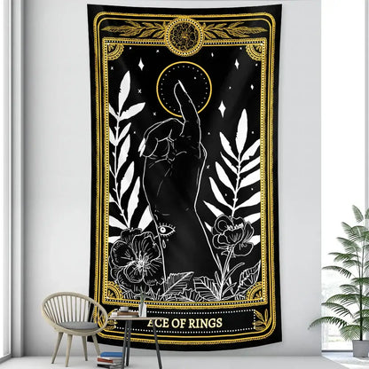 Black and gold vintage wheel of fortune tarot witchcraft tapestry with mystical hand and ornate botanical decorbites black design