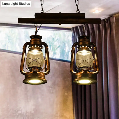 Vintage brass lanterns with clear glass globes hang from a rustic wooden bar in the DecorBites copper lantern island light