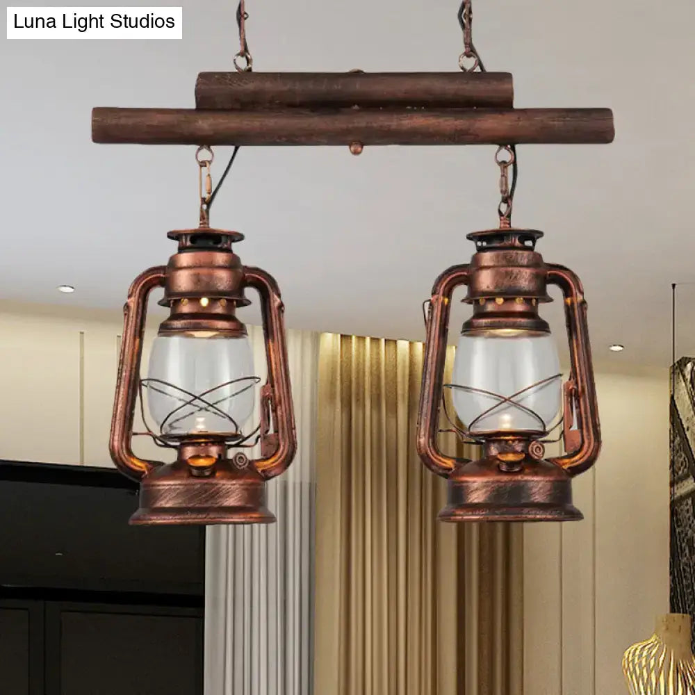 DecorBites™ copper lantern island light with clear glass and metal wire cages hanging from a rustic wooden beam