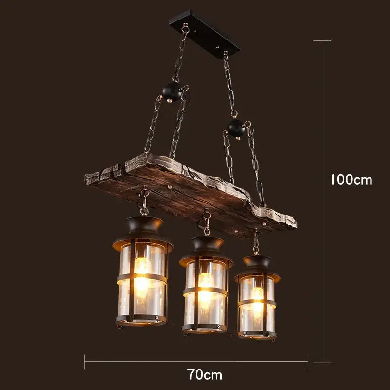 Vintage wood ceiling chandelier with three lanterns featuring weathered dark wood and black metal for dining room lighting