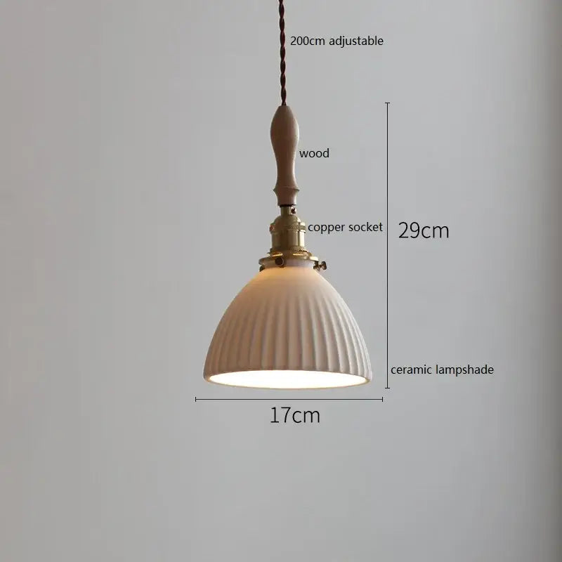 Cream-colored ceramic led pendant light with vertical ridges, wooden handle, and brass copper socket for dining room decorbites ceramic led