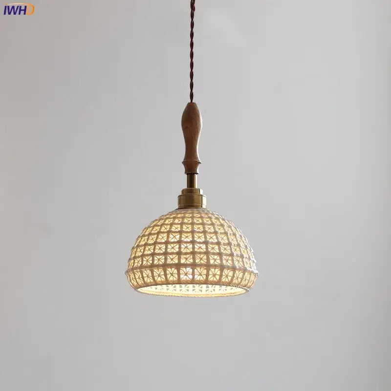 A warm-toned vintage woven rattan ceramic led pendant light with wooden handle and twisted cord for dining room decor