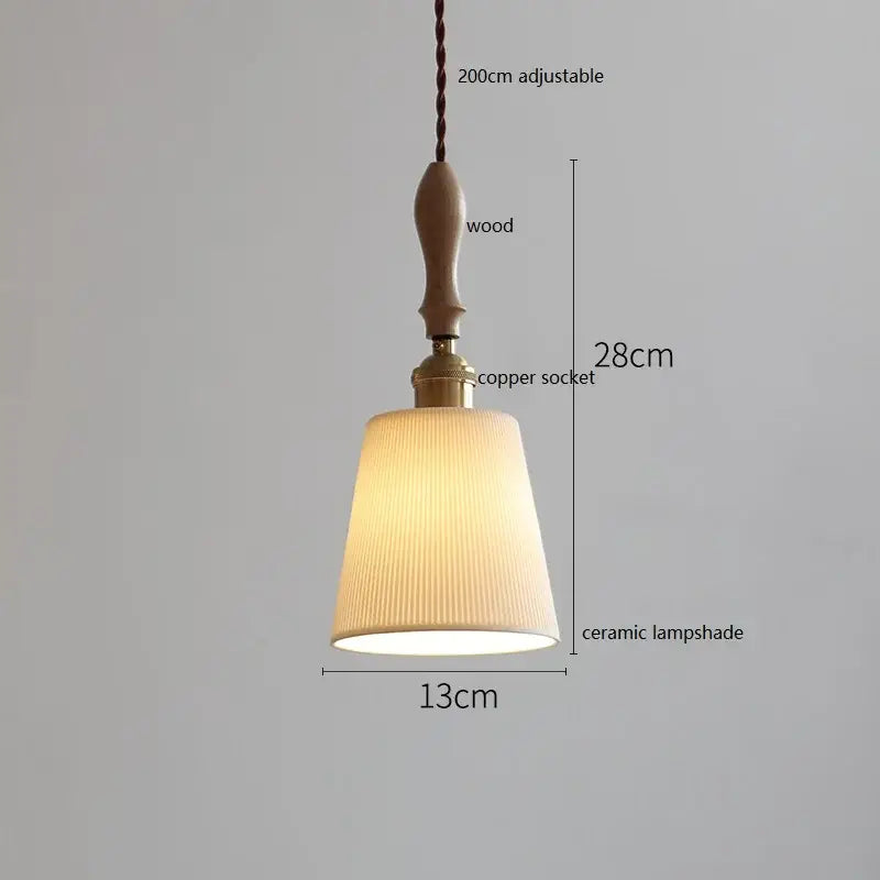A warm-toned ceramic led pendant light with vertical pleats and rattan accents for dining room decorbites ceramic led