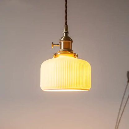 Warm yellow ribbed glass led pendant light with brass hardware and twisted cord for kitchen dining room pendant lights