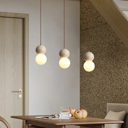 Three modern pendant lamps with textured concrete spheres and smooth white glass ball led shades for dining room decorbites glass ball