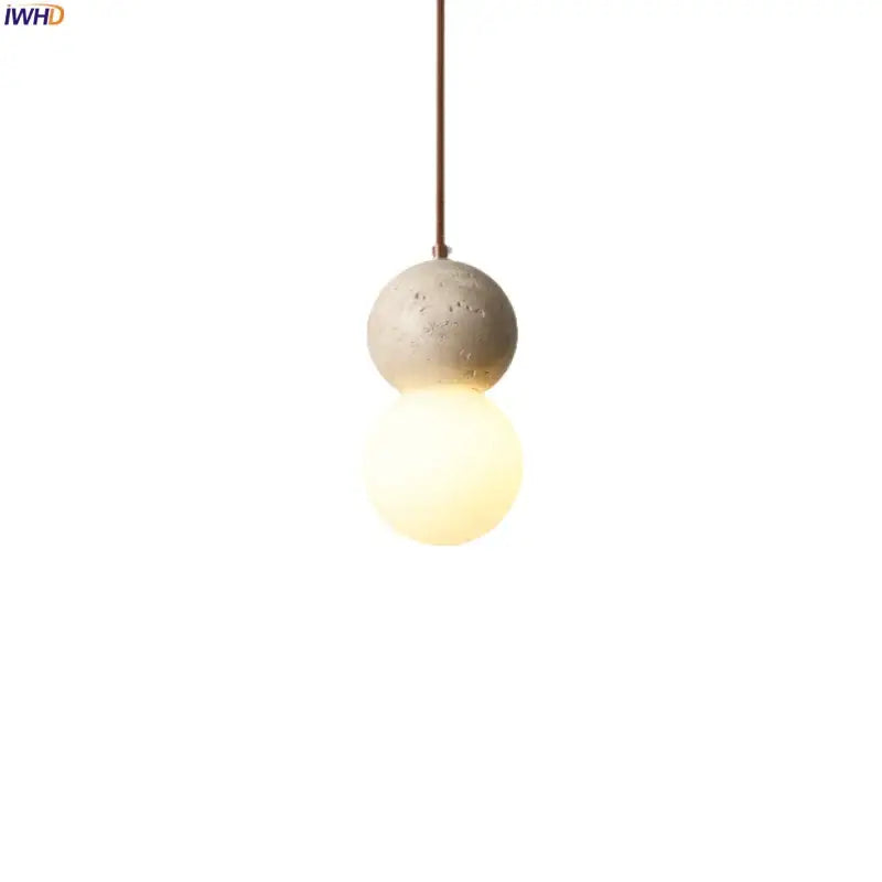 Vintage yellow travertine glass ball led pendant lamps featuring a concrete sphere pendant light with warm glass ball decorbites