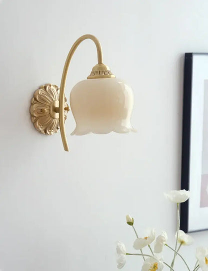 A delicate cream-colored pendant light with brass resin led floral design by decorbites for dining room decor
