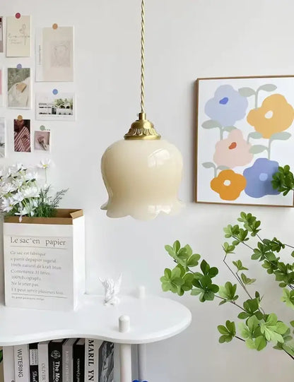 Cream-colored ceramic pendant light with gold-toned twisted cord and brass resin led fixture for dining room decorbites brass resin