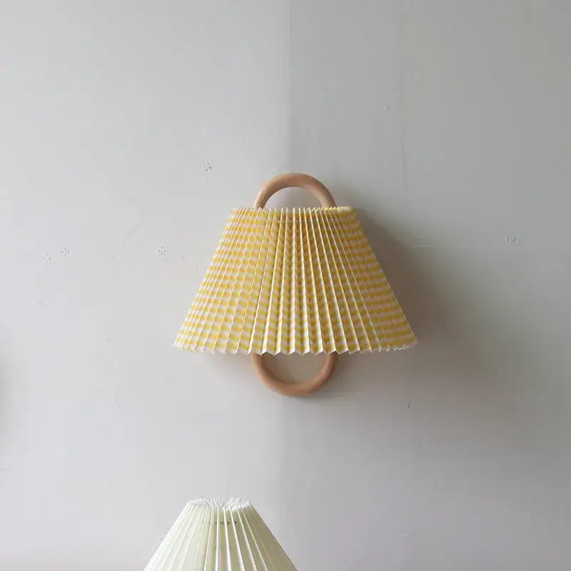 Wabi-sabi beech wood wall lamp with yellow and white striped pleated paper shade for bedroom lighting