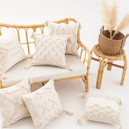 Cream-colored wabi-sabi beige geometric tufted cushion cover with textured embroidery and tassels for living room use