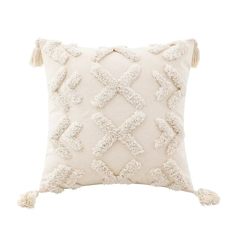 Cream-colored wabi-sabi tufted cushion cover with textured geometric patterns and tassels for living room use