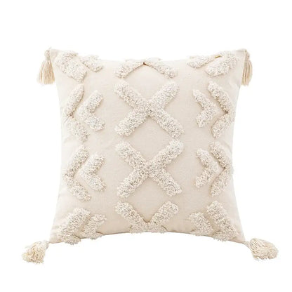 Cream-colored wabi-sabi tufted cushion cover with textured geometric patterns and tassels for living room use
