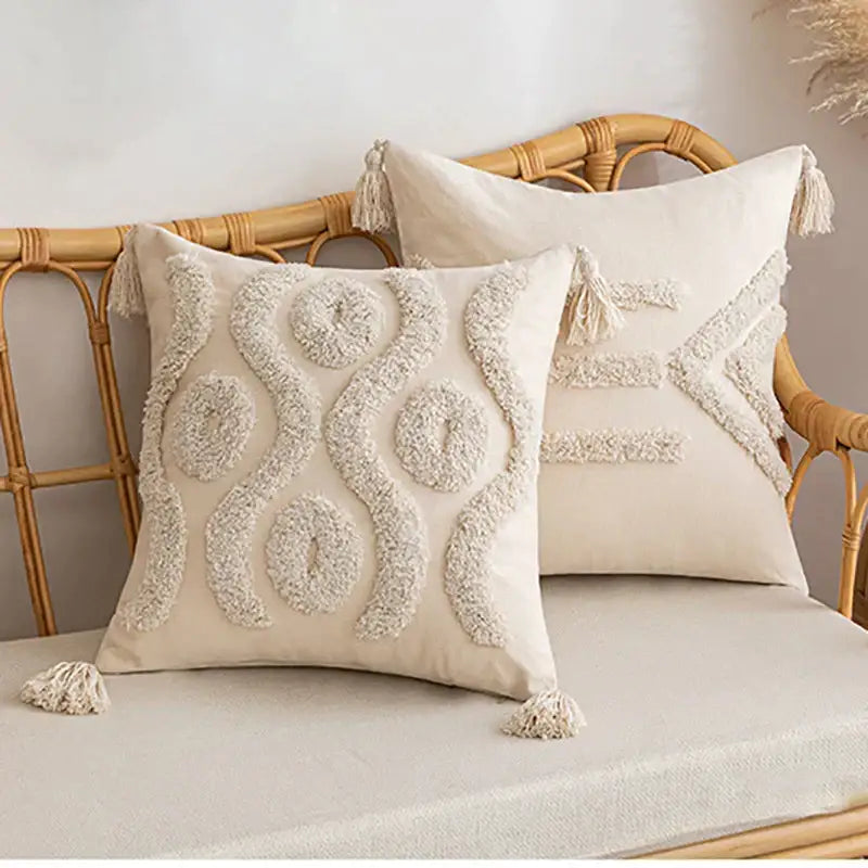 Cream-colored tufted cushion cover with textured fluffy embroidery and tassels for living room decor