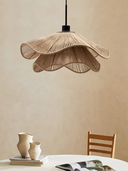 Beige woven rattan pendant light with black metal suspension rod offers stylish cord pendant installation for dining rooms