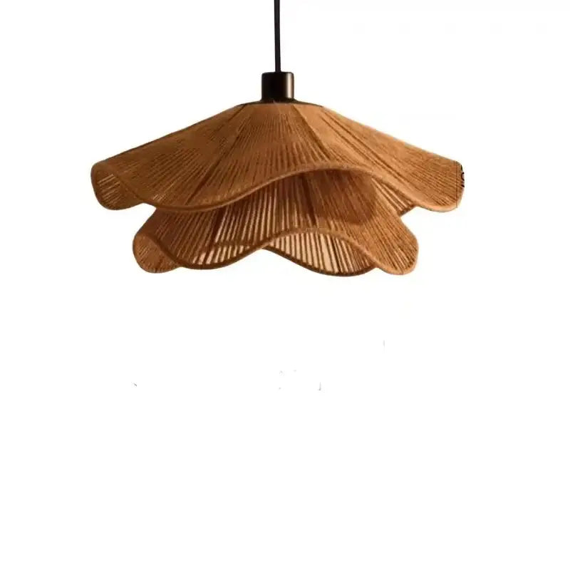 Wabi-sabi brown and beige woven rattan pendant light with warm-toned layered bamboo design for dining room with cord pendant installation