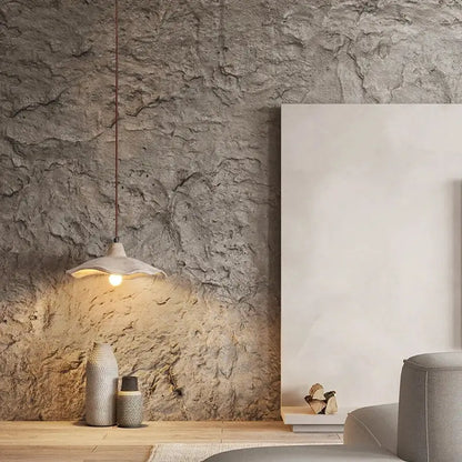 Wabi sabi pendant light with matte off-white ceramic shade and thin copper suspension featuring natural wood material