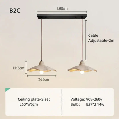 Black metal pendant light with two adjustable concrete-textured shades and natural wood accents for dining room