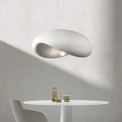 A sleek off-white wabi sabi cream style led chandelier with a smooth organic form and soft diffused glow for living room decorbites cream style