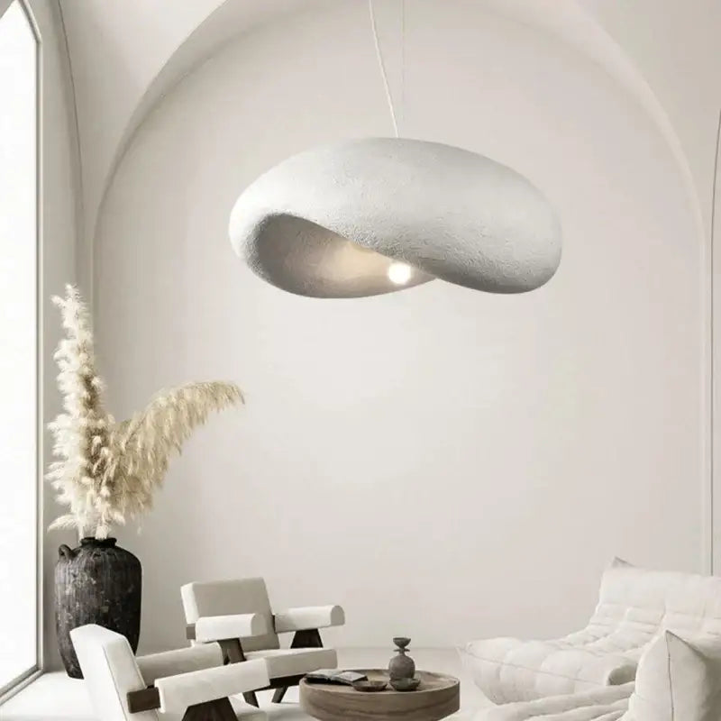 A sculptural off-white cream style led pendant light with textured organic form for dining room decorbites cream style