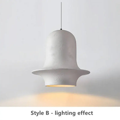 White ceramic bell-shaped pendant light with matte finish and warm glow for decorbites black wabi-sabi industrial chandelier