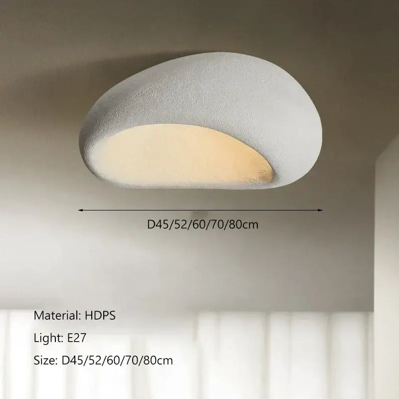 Wabi sabi matte cream ceiling chandelier in matte white hdps with rounded stone-like design and warm ambient glow