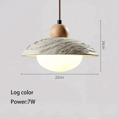 A modern wabi-sabi off-white cement pendant chandelier with a textured log-colored ceramic shade and natural wood top