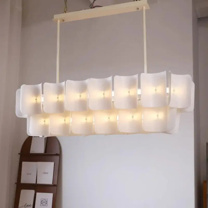 Modern wabi sabi off-white pendant light with frosted glass panels and painted iron finish for dining room use