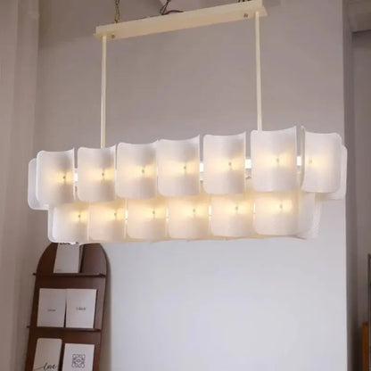 Modern wabi sabi off-white pendant light with frosted glass panels and painted iron finish for dining room use