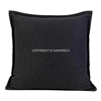 Black textured throw pillow case with subtle heathered finish and stitched edges for living room decor