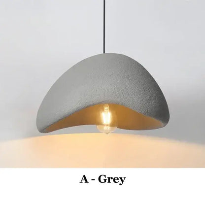 Wabi-sabi high polymer gray pendant light with matte exterior and warm gold interior for contemporary interiors
