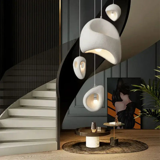 Modern white high polymer pendant light with organic sculptural shapes featuring led bulbs for dining room use