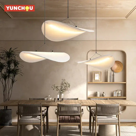 Three white wabi sabi silk cloud pendant lights with smooth matte finish and led bulb hanging cord pendant for living room
