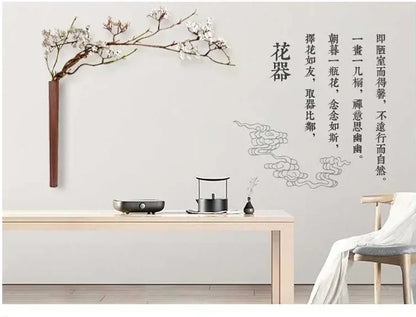 A minimalist wooden table with sleek modern design complementing a wall hanging solid wood bohemian vase decoration