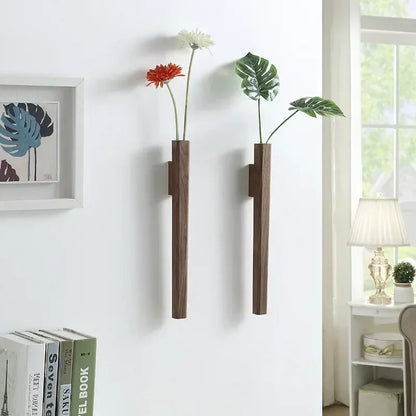 Two sleek dark brown solid wood wall hanging vases with minimalist design for living room or porch decoration
